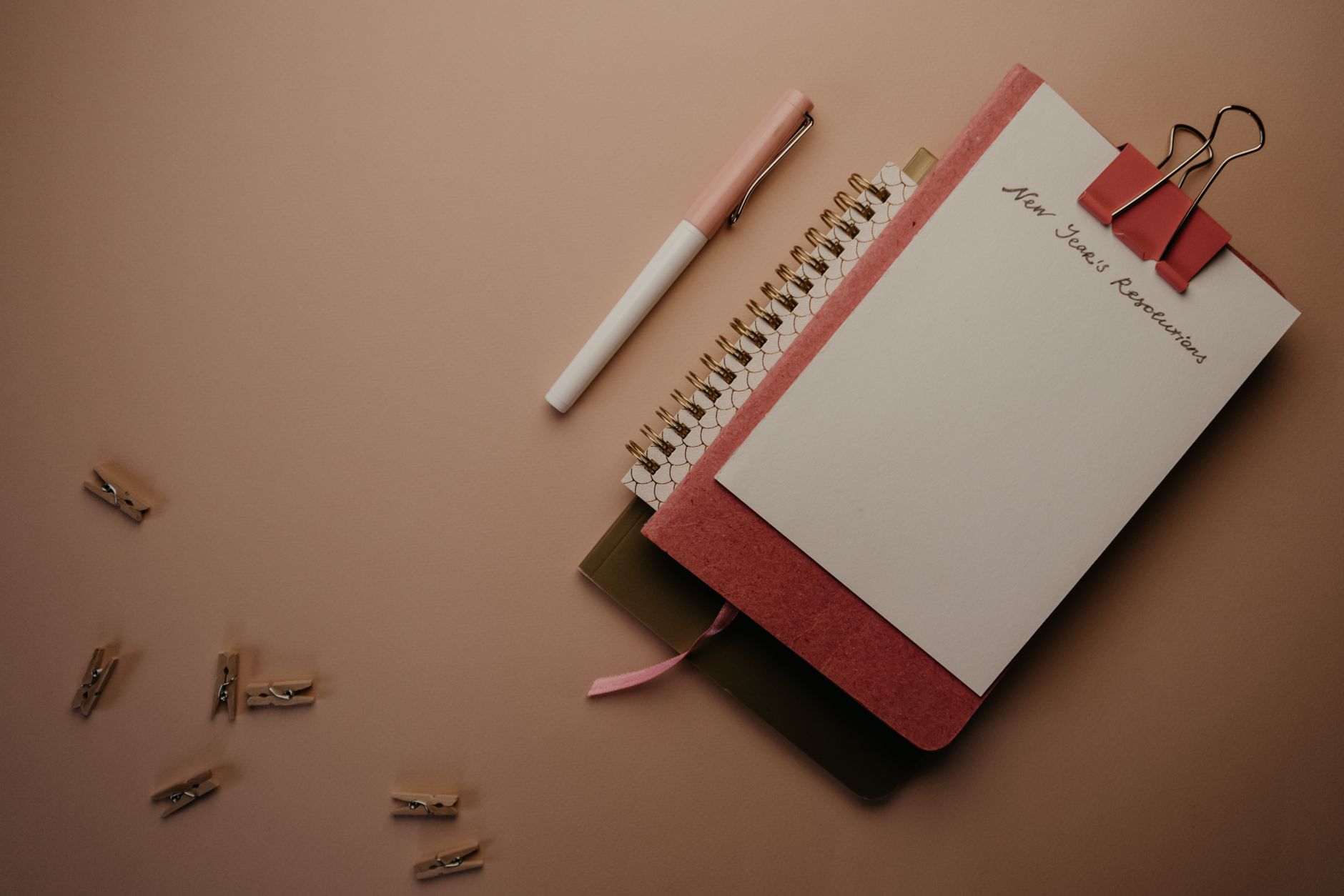 Person writing in a journal and planning Bible study goals for the new year