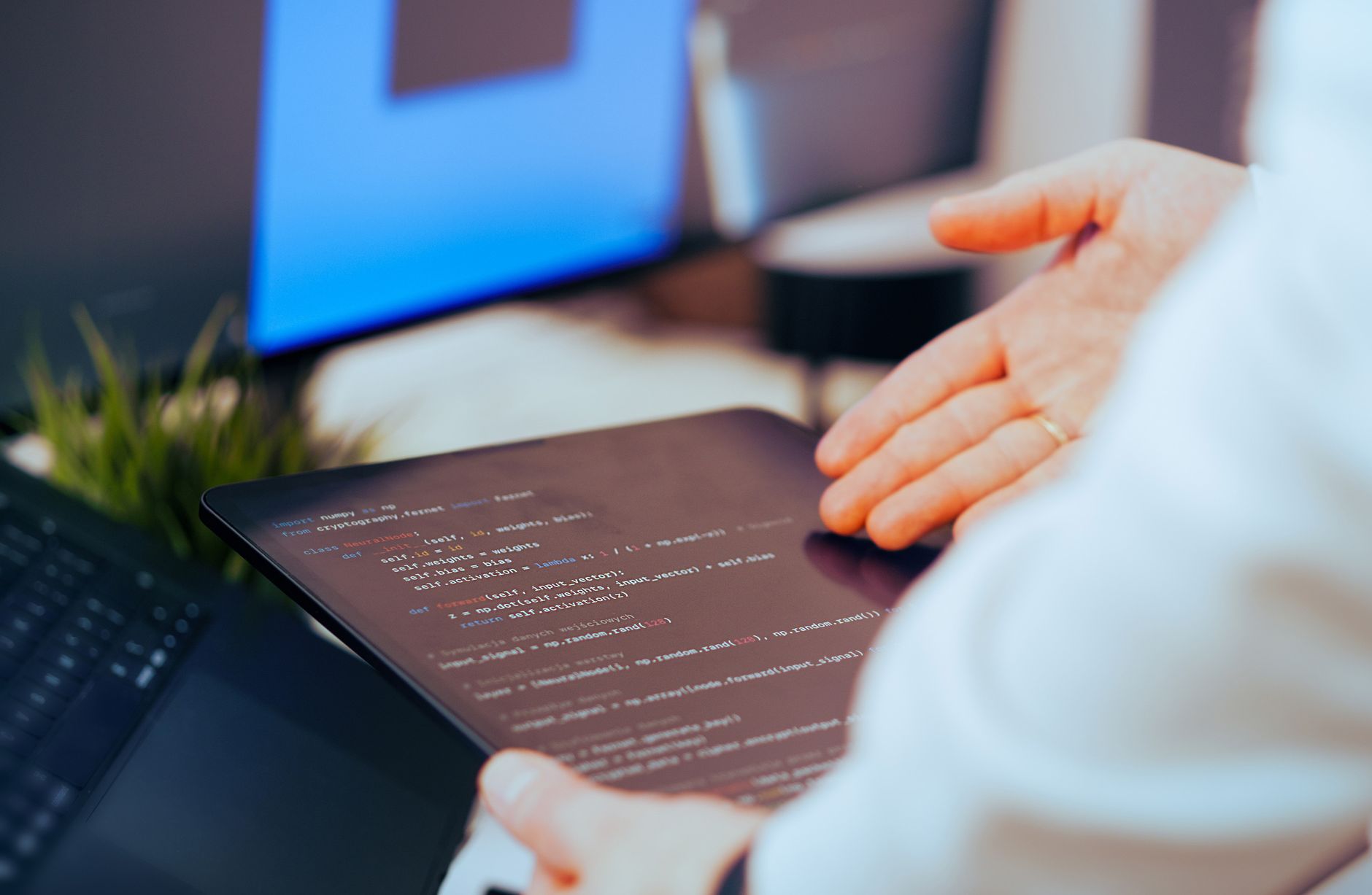 Person using a Bible study app on a tablet with multiple translation panels open