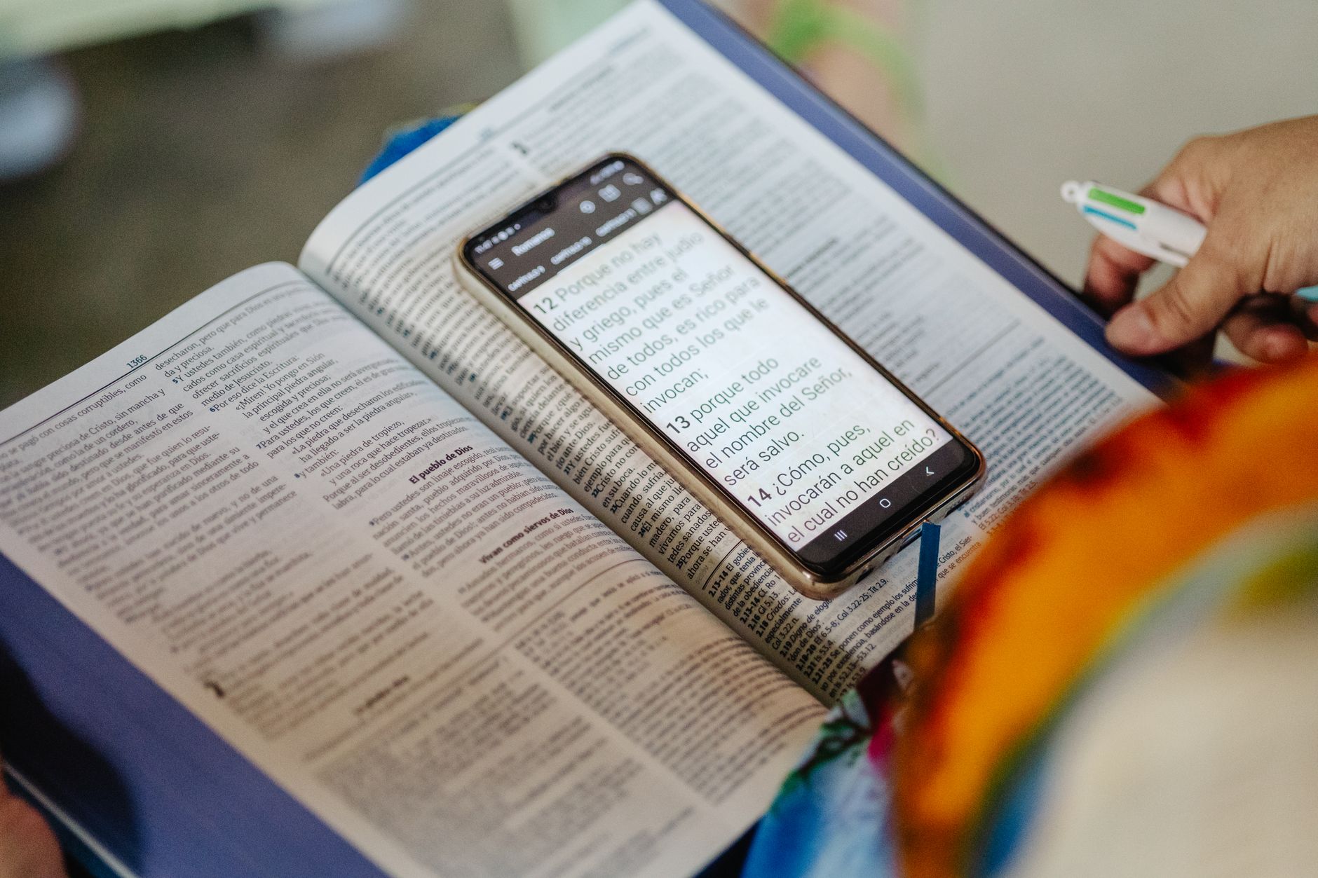smartphone displaying bible study app with commentary notes